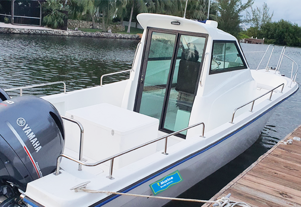 T Marine White Motorboat sa Dock