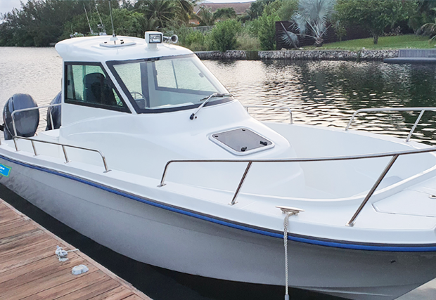 T Marine White Motorboat sa Dock